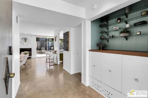 a view of kitchen with furniture and wooden floor