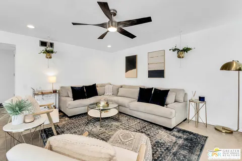 a living room with furniture and a rug