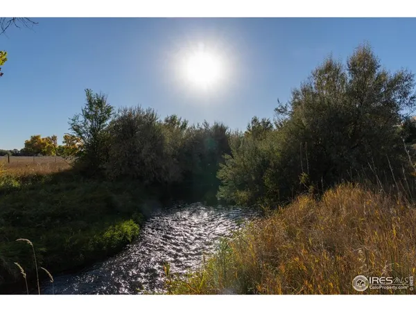 a view of swimming pool and lake