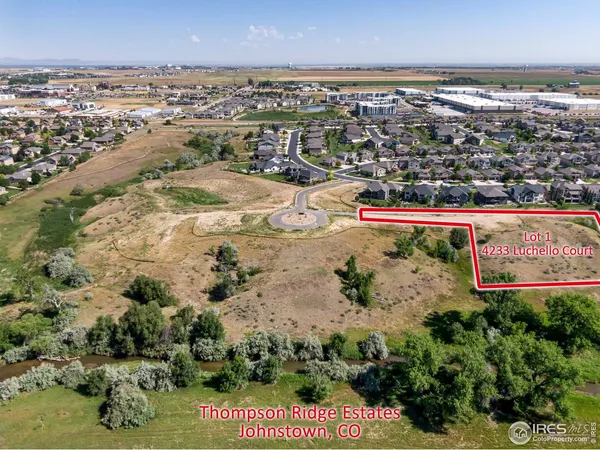 an aerial view of swimming pool and a yard
