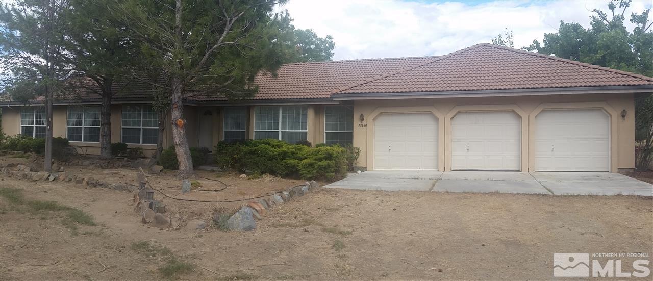 13660 Partei Valley Road Reno, NV 89510 - Photo 1 of 1 a view of an house with backyard space and garden