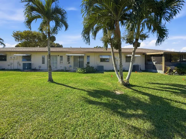 a view of a swimming pool with sitting area