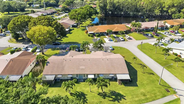 an aerial view of a house with garden space and ocean view