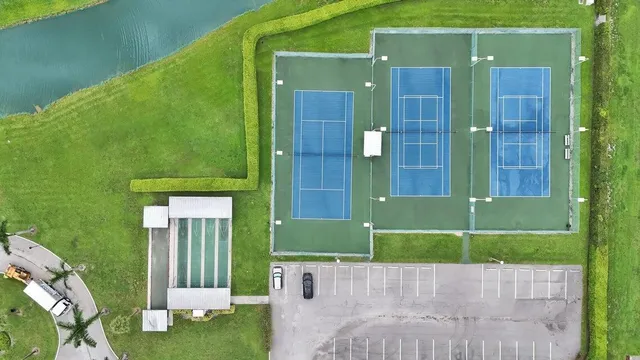 an aerial view of a house with a lake view