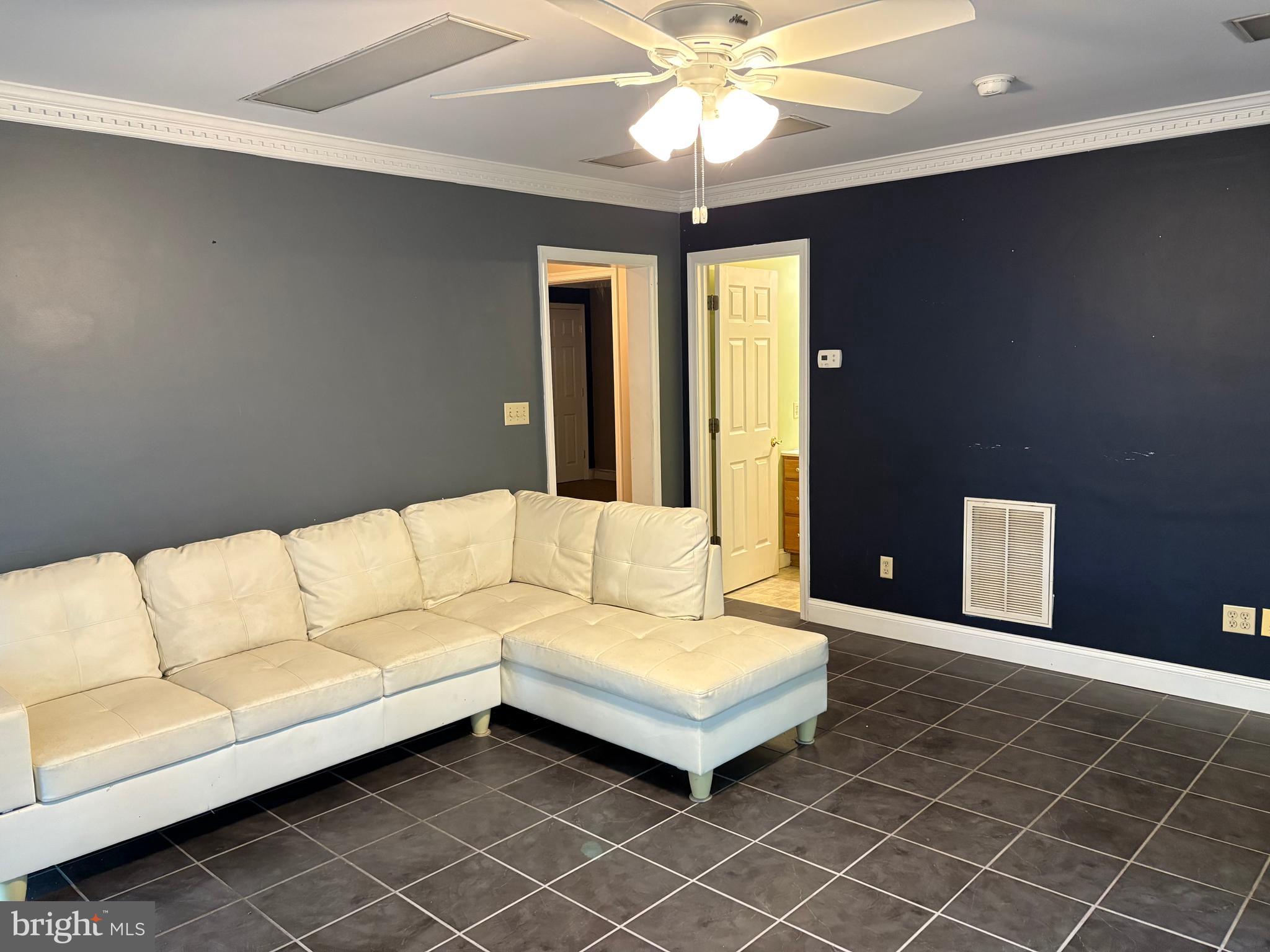 31867 Shavox Road Salisbury, MD 21804 - Photo 44 of 64 a living room with furniture and a ceiling fan