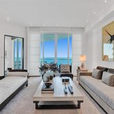 a living room with furniture rug and window