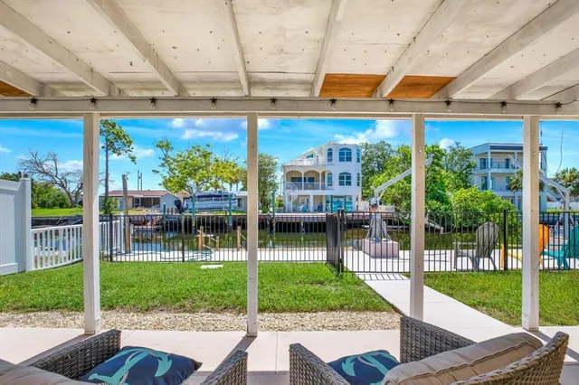 a view of backyard with porch and outdoor seating