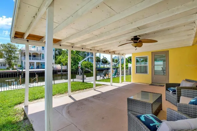 a view of a livingroom with furniture and garden view