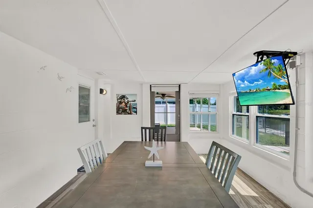 workspace with wooden floor and windows