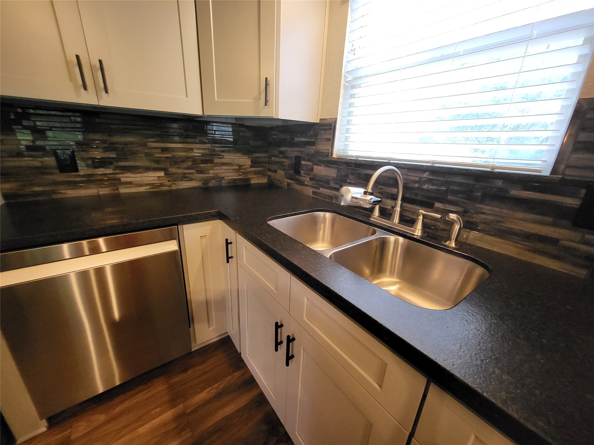 30 Ridge Creek Drive Coldspring, TX 77331 - Photo 17 of 38 a kitchen with sink a microwave and cabinets