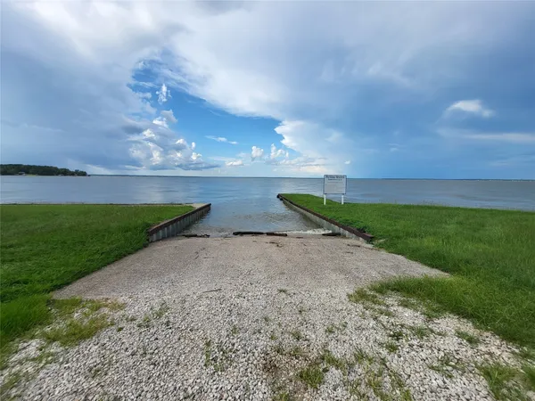 a view of a lake and a yard