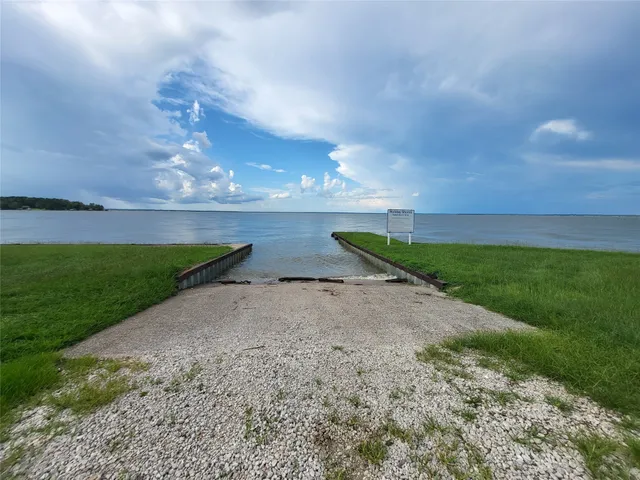 a view of a lake and a yard