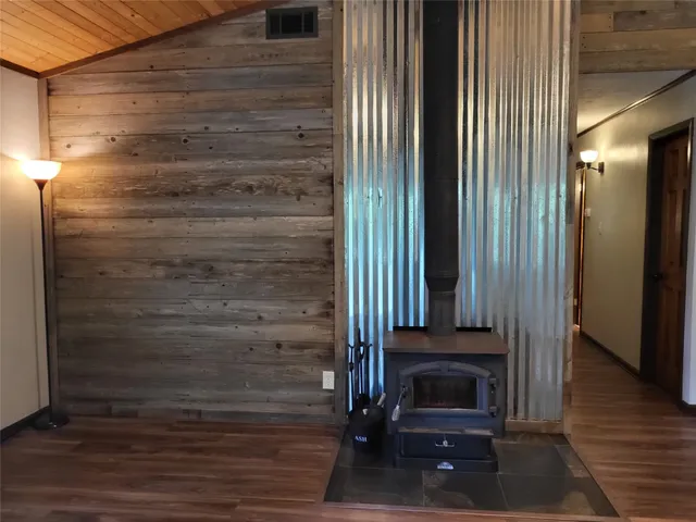 a view of an entryway door with wooden floor