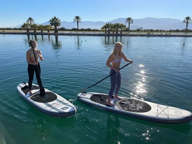 a outdoor living space with furniture and a lake view