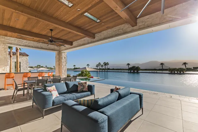 a view of a swimming pool with a lounge chair