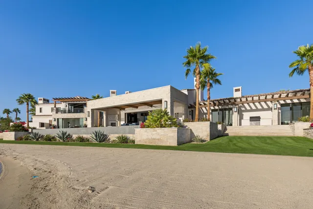 a view of a living room and chandelier