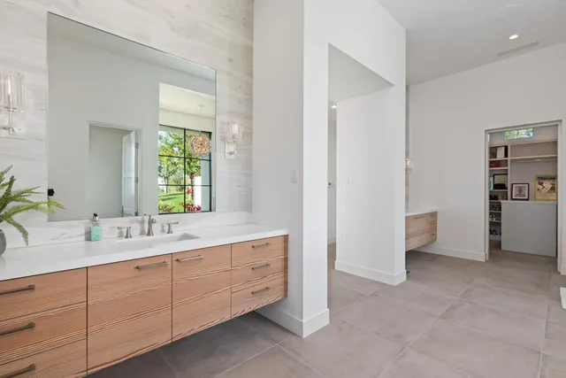 a room with a sink and a mirror