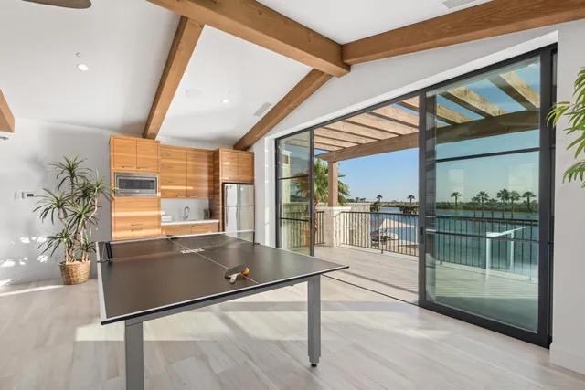 a living room with two couches and a painting on the wall