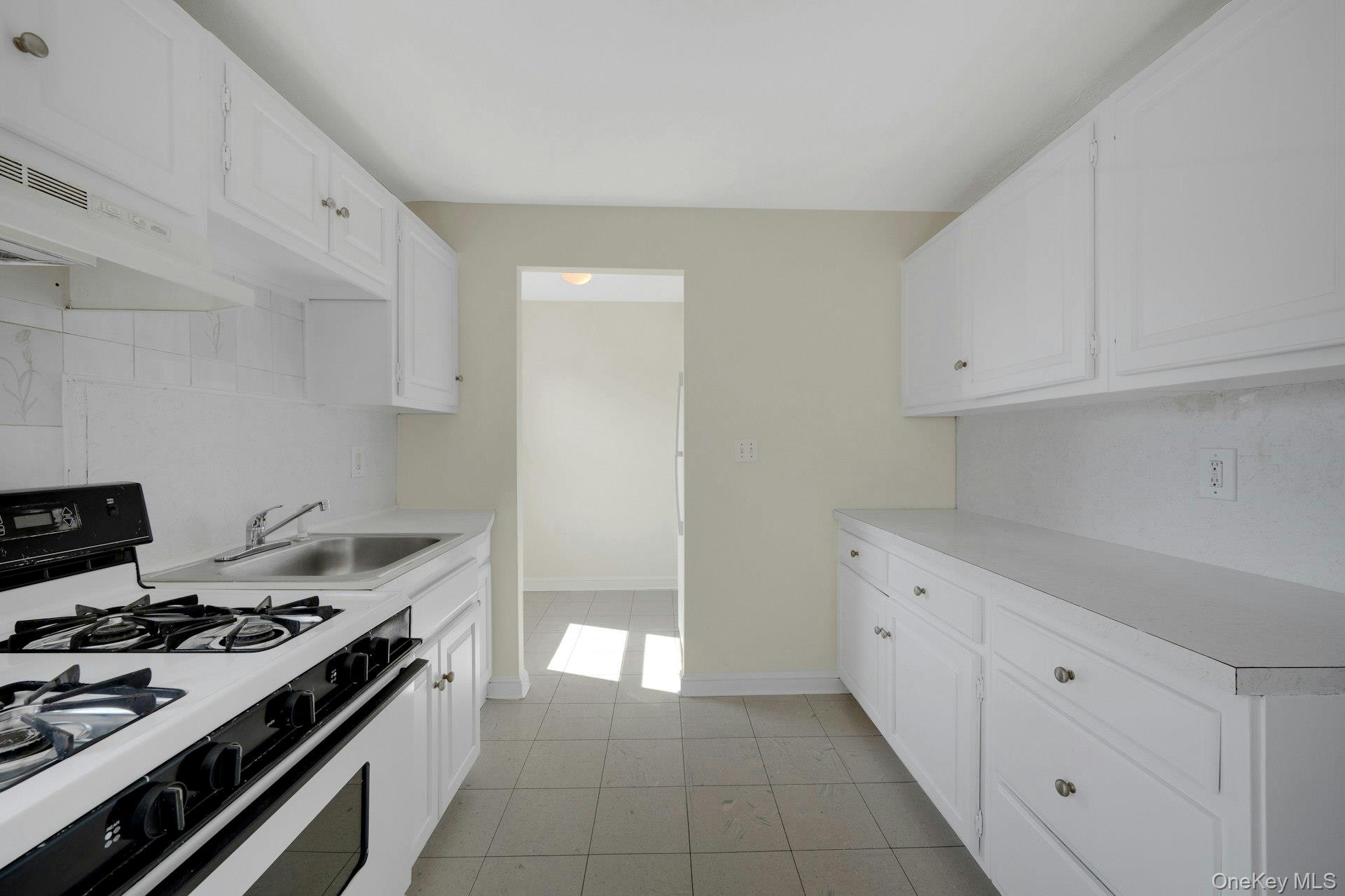 56 Stephenson Boulevard New Rochelle, NY 10801 - Photo 16 of 44 a kitchen with a stove and a sink