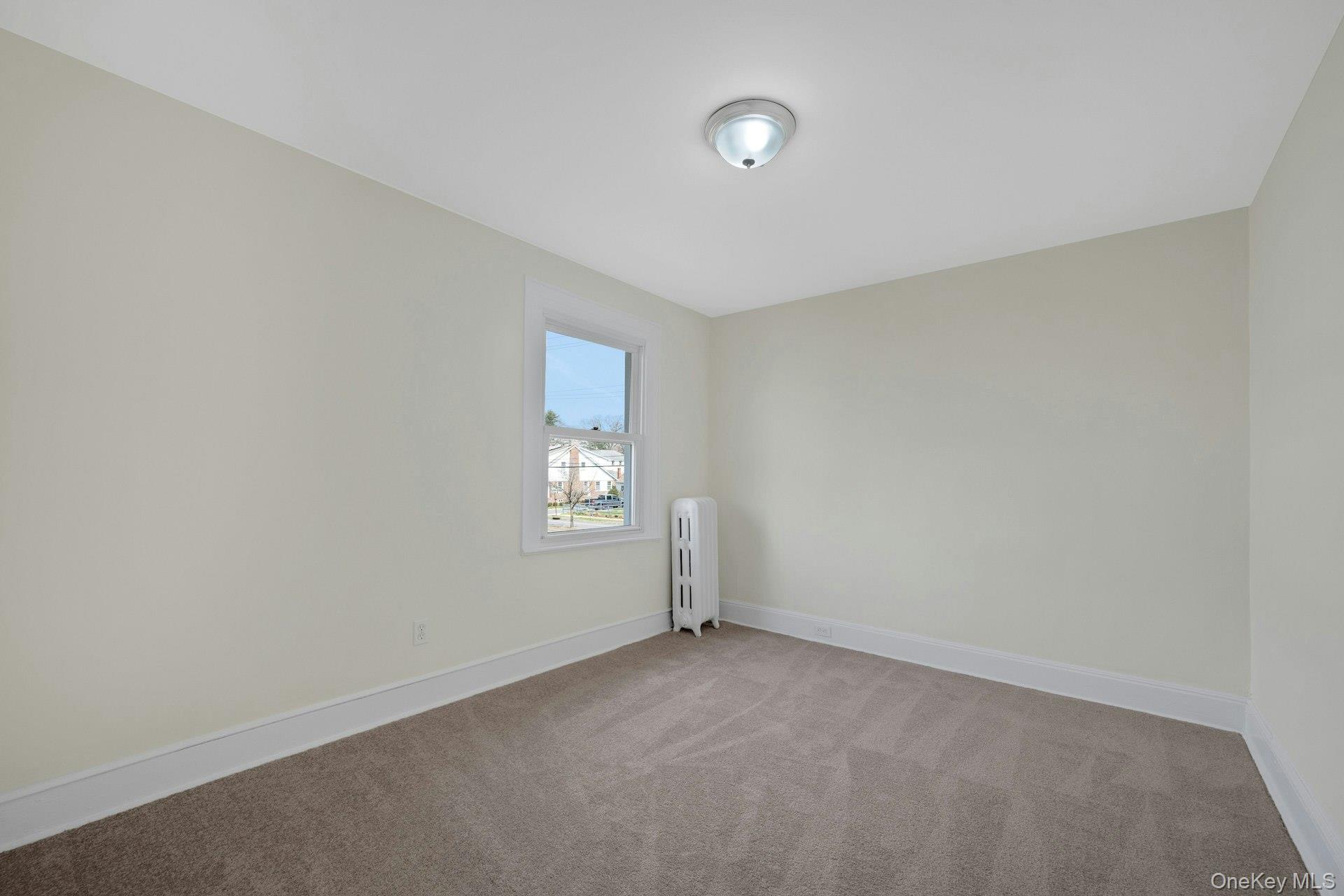 56 Stephenson Boulevard New Rochelle, NY 10801 - Photo 18 of 44 an empty room with a window
