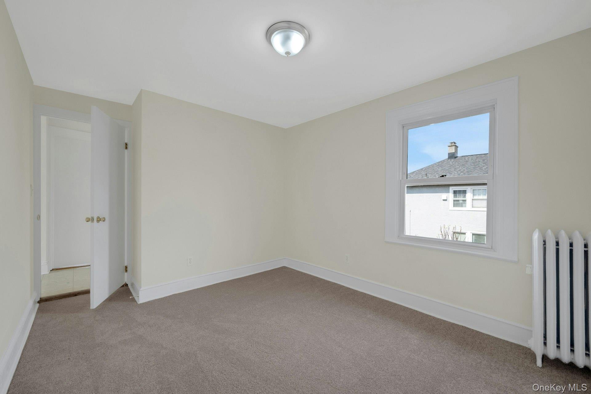 56 Stephenson Boulevard New Rochelle, NY 10801 - Photo 19 of 44 an empty room with a window