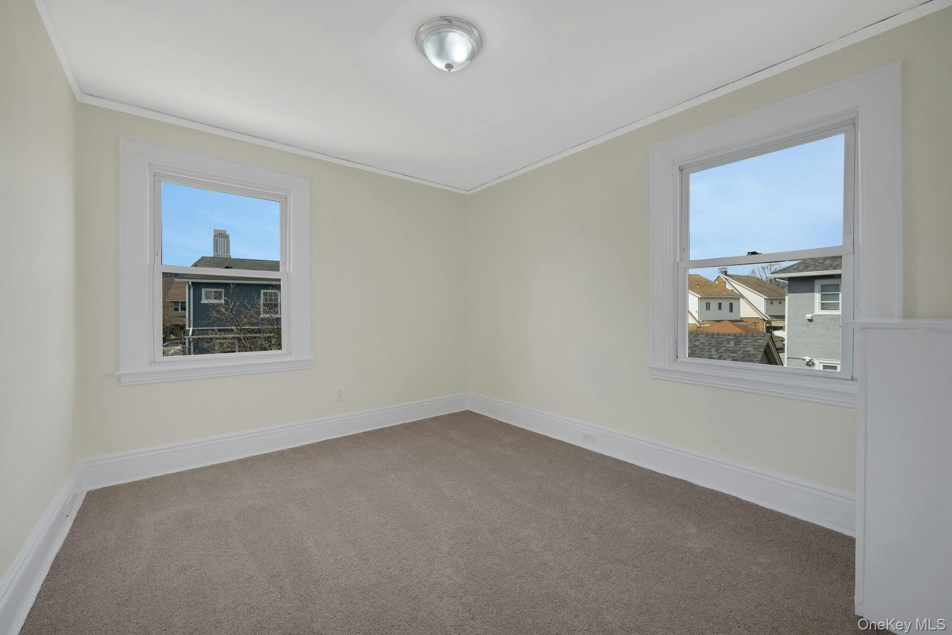 56 Stephenson Boulevard New Rochelle, NY 10801 - Photo 20 of 44 a view of an empty room with a window