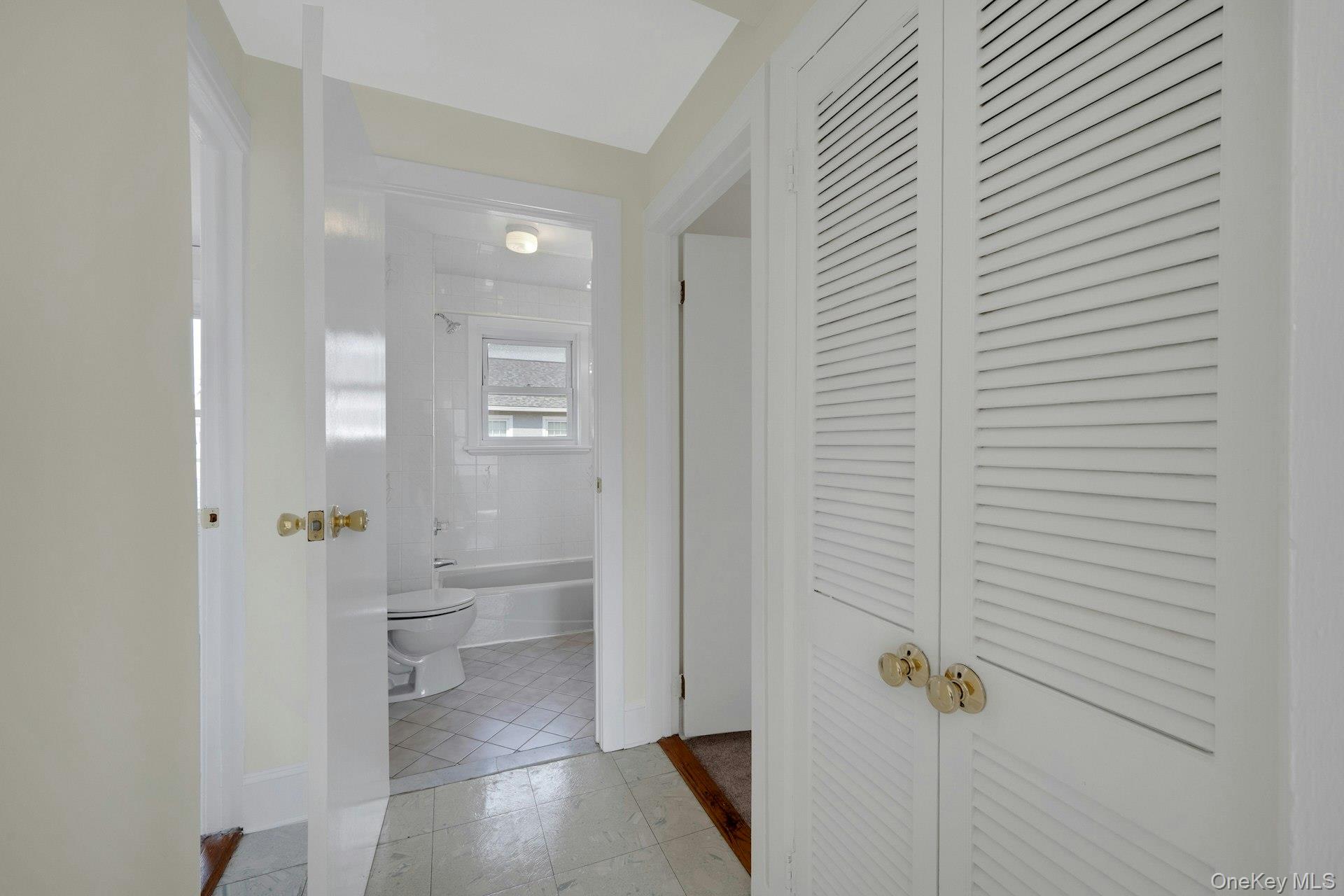 56 Stephenson Boulevard New Rochelle, NY 10801 - Photo 23 of 44 a bathroom with a granite countertop sink a toilet and shower