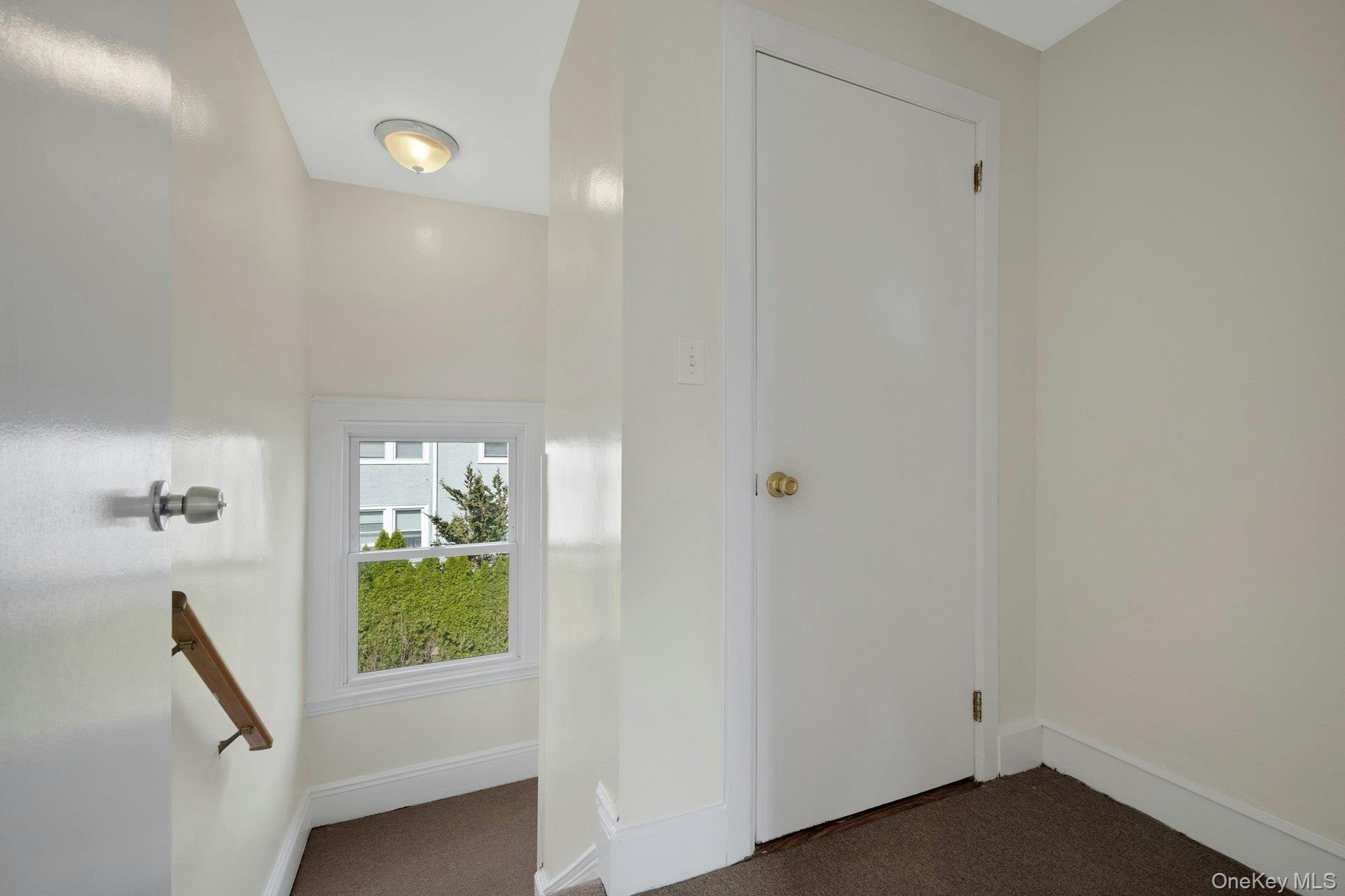 56 Stephenson Boulevard New Rochelle, NY 10801 - Photo 24 of 44 a view of hallway with furniture and a window