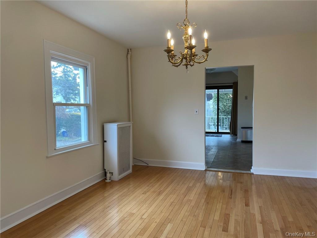 56 Stephenson Boulevard New Rochelle, NY 10801 - Photo 25 of 44 a view of livingroom with window and wooden floor