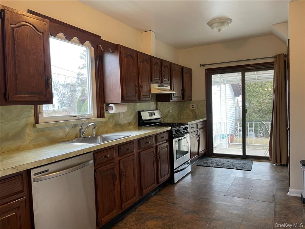 56 Stephenson Boulevard New Rochelle, NY 10801 - Photo 27 of 44 a kitchen with a sink a counter top space and cabinets