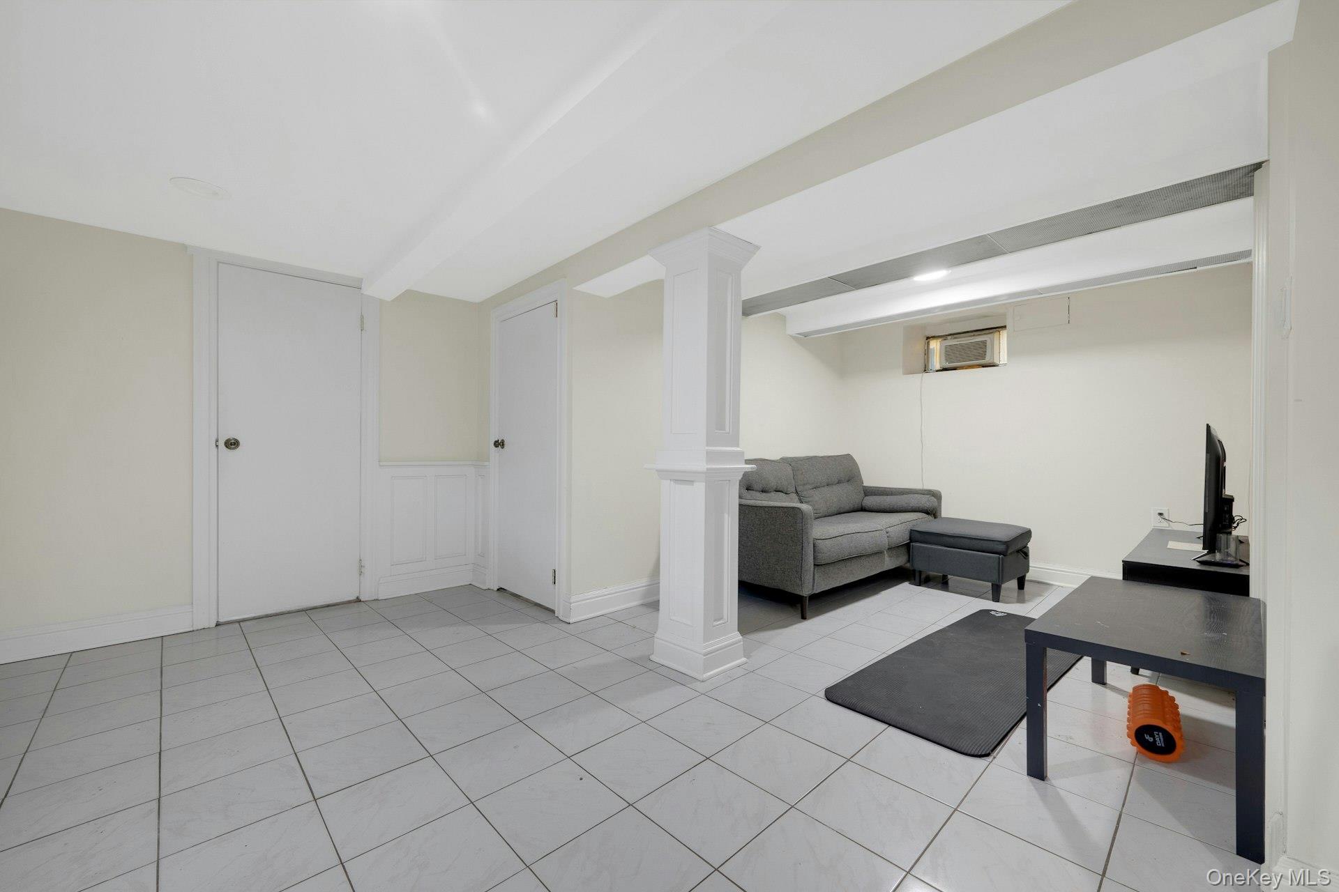 56 Stephenson Boulevard New Rochelle, NY 10801 - Photo 29 of 44 a living room with furniture and a couch