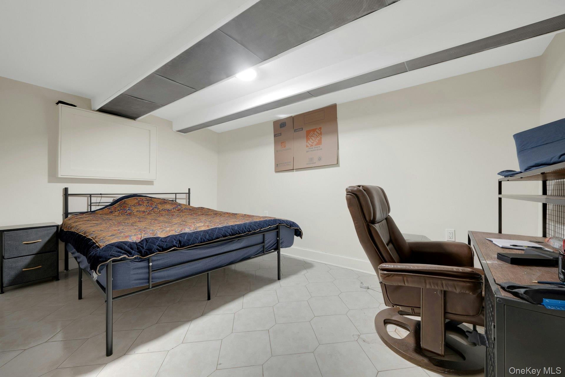 56 Stephenson Boulevard New Rochelle, NY 10801 - Photo 34 of 44 a bedroom with a bed a desk and chair