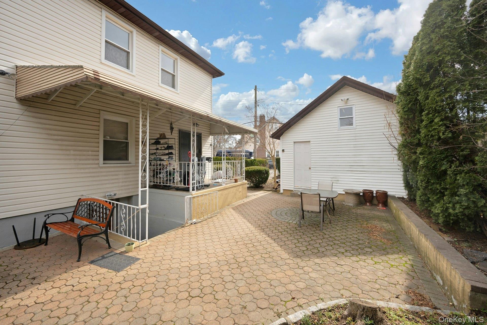 56 Stephenson Boulevard New Rochelle, NY 10801 - Photo 39 of 44 a backyard of a house with table and chairs