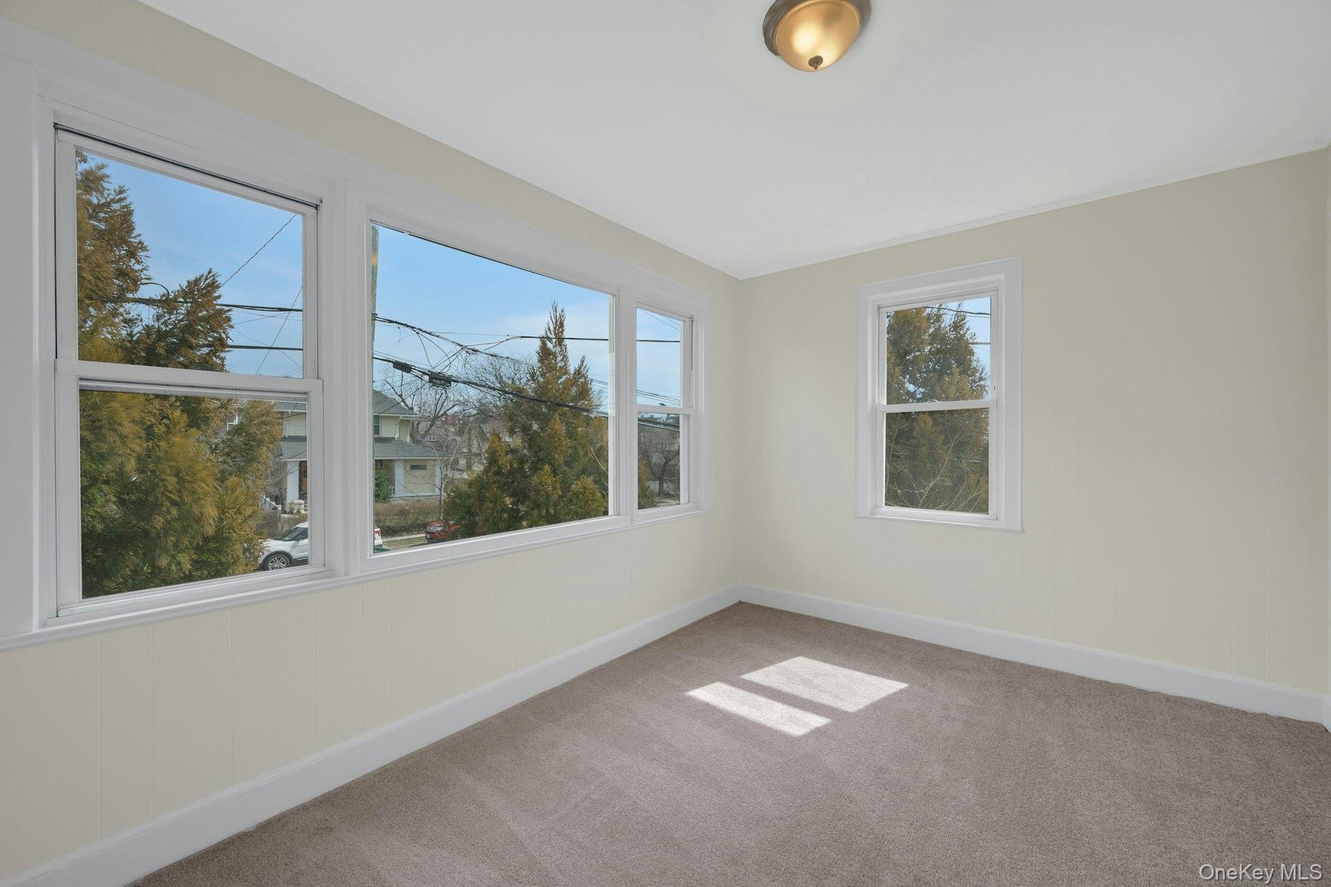 56 Stephenson Boulevard New Rochelle, NY 10801 - Photo 4 of 44 a view of an empty room with a window