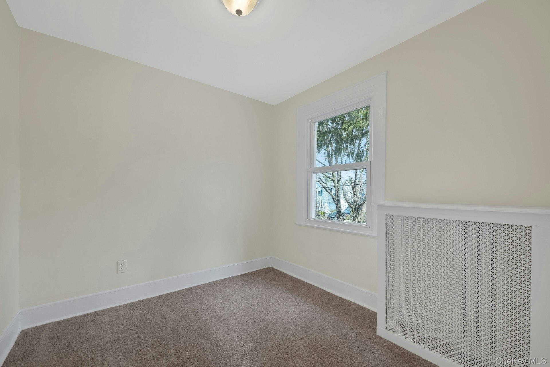 56 Stephenson Boulevard New Rochelle, NY 10801 - Photo 10 of 44 an empty room with a window