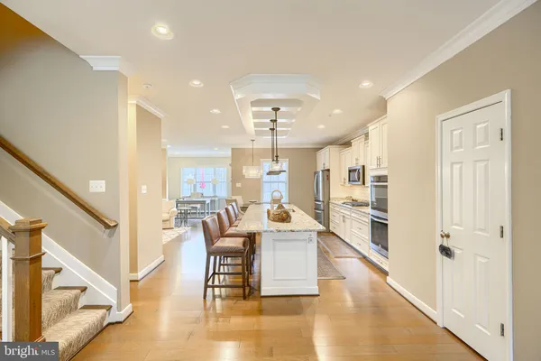 a view of a kitchen and dining room