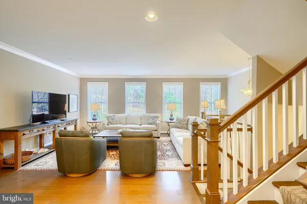 a living room with lots of furniture and a flat screen tv