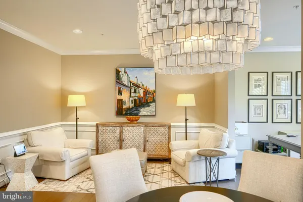 a living room with furniture and a lamp