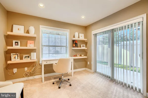 a bedroom with furniture and a large window