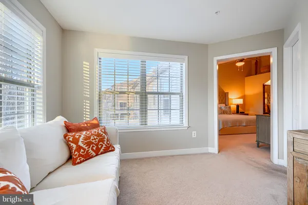 a bathroom with a granite countertop tub sink and mirror
