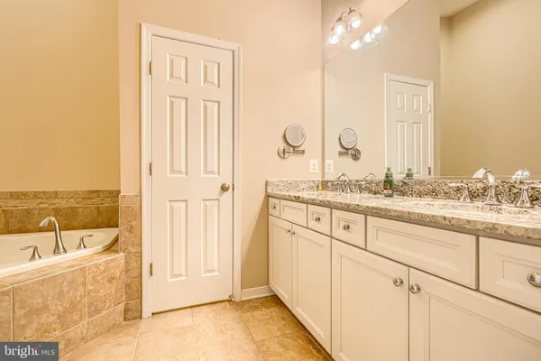 a bathroom with a bathtub and shower