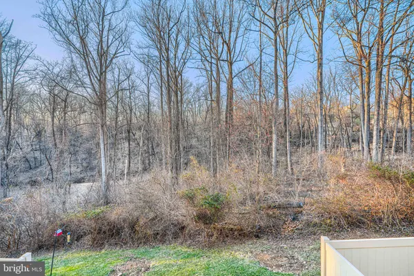a backyard of a house with lots of green space and garden