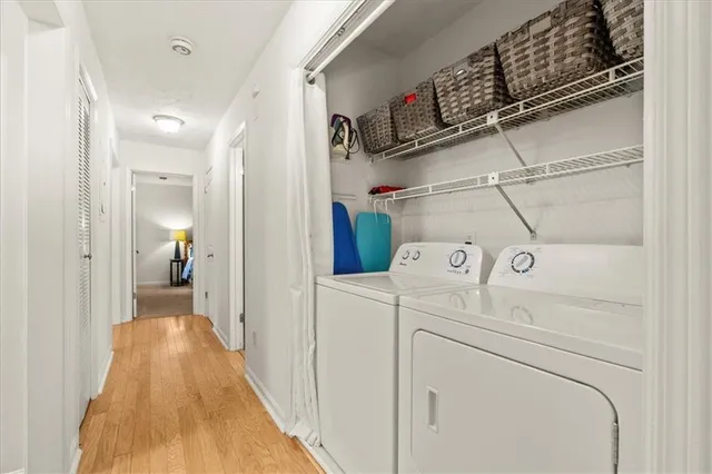 a view of a hallway with washer and dryer