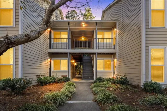 a front view of house and yard with green space