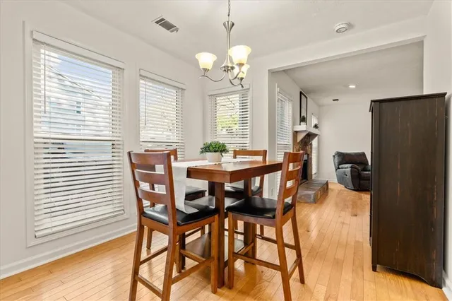 a view of a dining room with furniture and window
