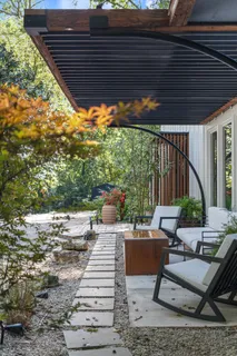 a living room with fireplace furniture and a fireplace