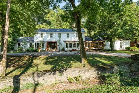 a living room with furniture fireplace and a flat screen tv