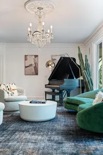 a bathroom with a sink mirror and a bathtub next to a window