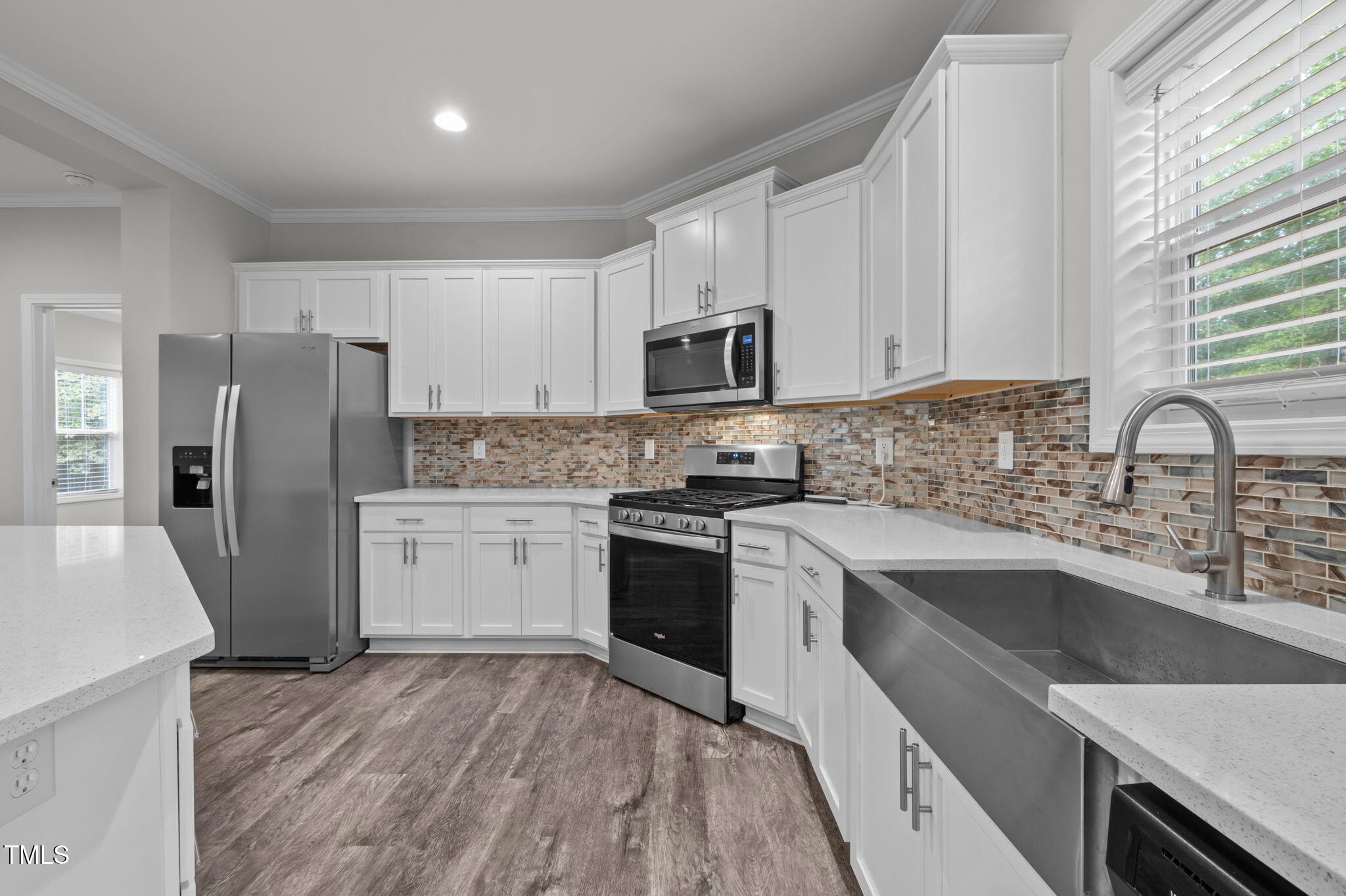 221 Country Lane Timberlake, NC 27583 - Photo 12 of 39 a kitchen with a sink stove and refrigerator