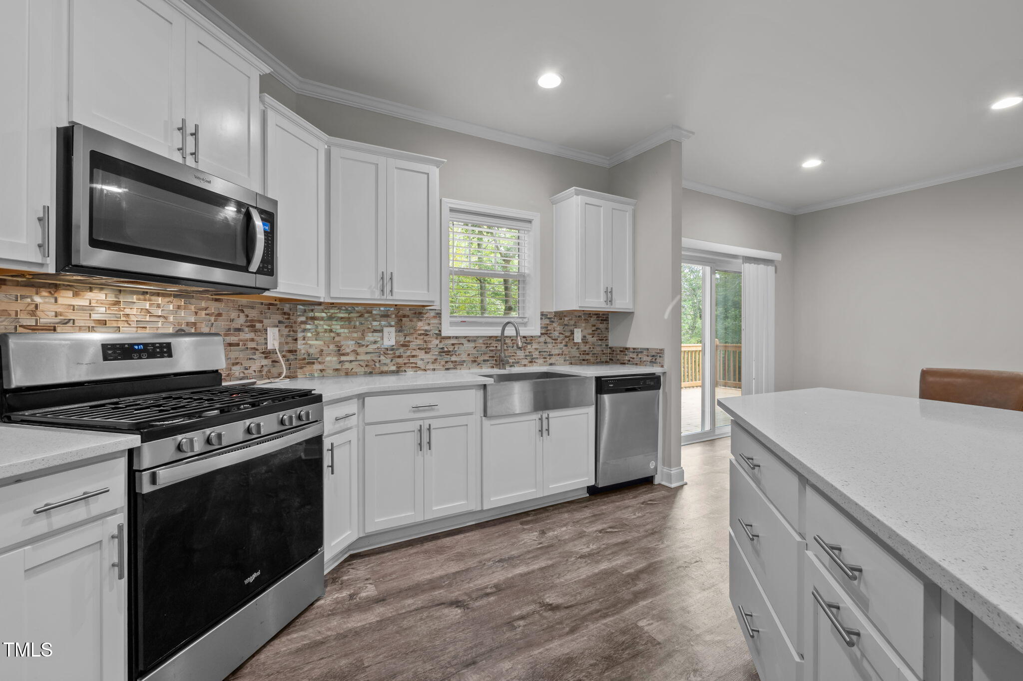 221 Country Lane Timberlake, NC 27583 - Photo 13 of 39 a kitchen with a stove and a microwave